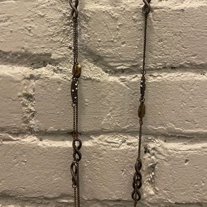 Long Gold necklace with accents.